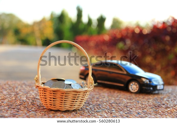 Car model and Financial statement with\
coins, finance and loan concept, saving\
money