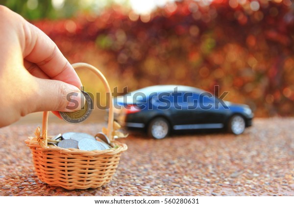 Car model and Financial statement with\
coins, finance and loan concept, saving\
money