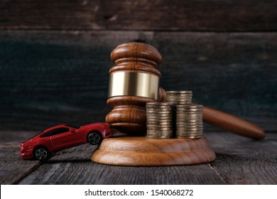 Car model and judges hammer, concept of protecting the rights of motorists, dispute resolution of road traffic accidents, legal consultation. - Shutterstock ID 1540068272