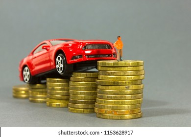 Car Model And  Man's Figure On  Coin Background. Concept Of Leasing, Auto Loan, Auto Insurance, Taxes.