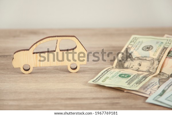 car model with money on the\
table