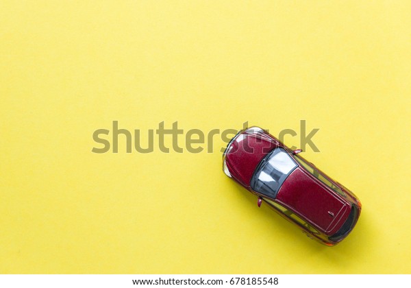 Car\
model on yellow background with copyspace, image can be used for\
car rental and car insurance and travelling\
concept