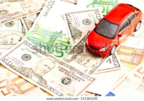 Car and money. Concept for buying,\
renting, insurance, fuel, service and repair\
costs