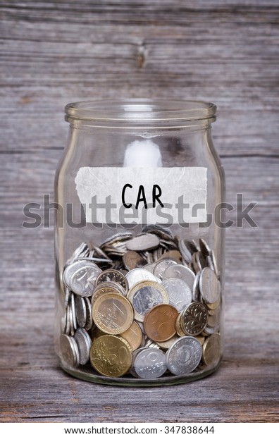 car,
money jar with coins on wood table , saving
concept