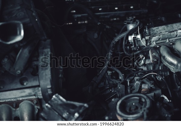 Car motor parts. Auto motor mechanic spare or\
automotive piece on dark\
background