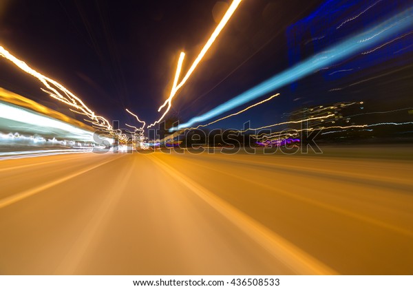 The car moves at\
great speed at the night.