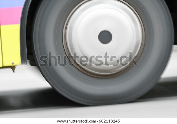 Car moving on\
streets with rolling wheel