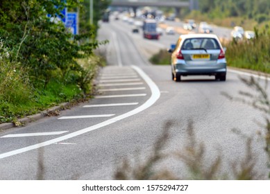 Car Moving Towards Uk Motorway On Junction Exit In England