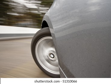 Car Moving Very Fast Or Speeding With Wheels Spinning Making A Left Turn