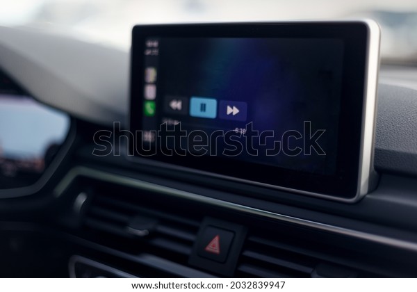 Car\
multimedia system. Glowing beautiful dashboard of a modern\
expensive car. The interior of the car. The foreground is blurred.\
Modern car interior details. Selective\
focus