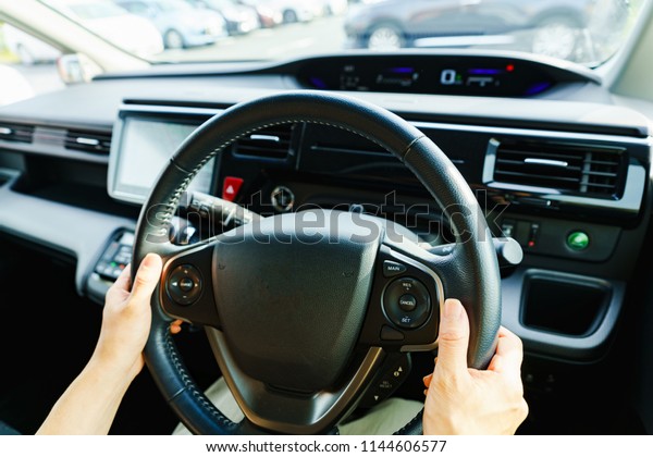 car\
navigation system and japanese woman\'s\
hand