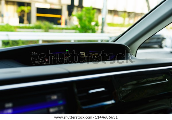 car\
navigation system and japanese woman\'s\
hand