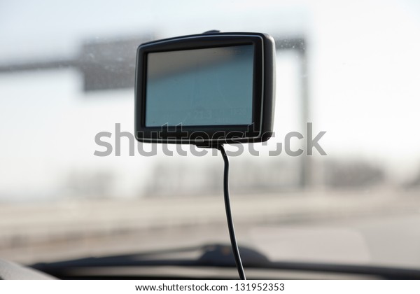 Car navigation\
system on front window in\
car.
