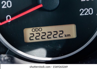 Car odometer reaches a two hundred and twenty-two thousand two hundred and twenty-two kilometres.