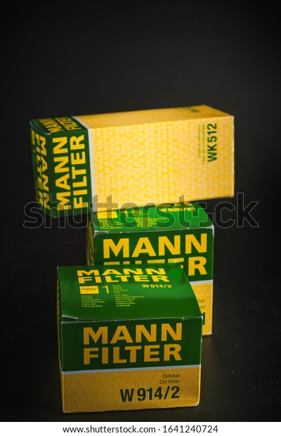 Car oil filter Mann. Mann
filter. Filters on black background. oil filter in oil change
pack