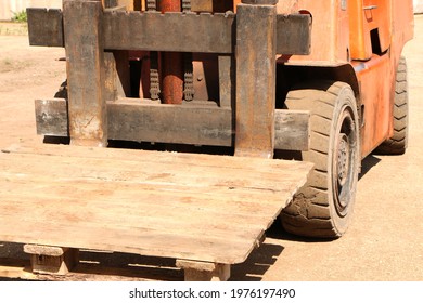 Car -Old Forklift, Forklift, Stacker Truck, Warehouse Forklift. Old Car Under Repair In The Garage.