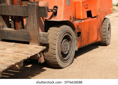 Car -Old Forklift, Forklift, Stacker Truck, Warehouse Forklift. Old Car Under Repair In The Garage.