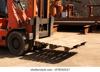 Car -Old Forklift, Forklift, Stacker Truck, Warehouse Forklift. Old Car Under Repair In The Garage.