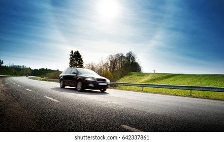 Car On Asphalt Road In Beautiful Spring Day At Countryside