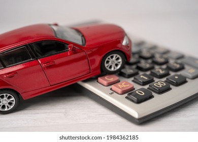 Car On Calculator, Car Loan, Finance, Saving Money, Insurance And Leasing Time Concepts.