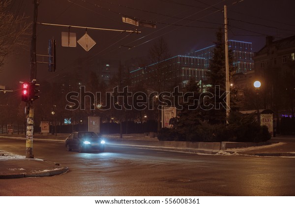 car on city street. winter\
night