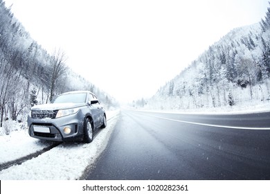 Car On Country Road In Snowy Weather