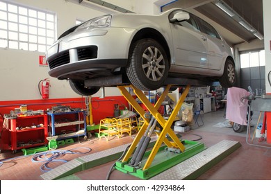 Car On A Lift In A Garage