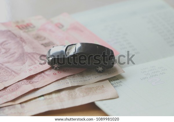 car on money and book\
bank.
