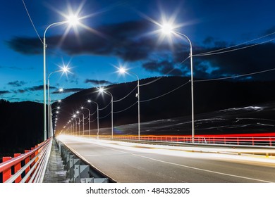 The Car On The Night Bridge. Divnogorsk Siberia In The North-western Spurs Of The East Sayan