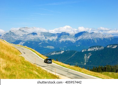 Car On The Road At The Alps. 