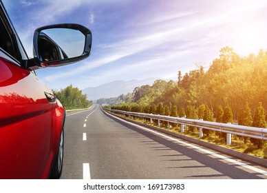 Car On The Road With Motion Blur Background.