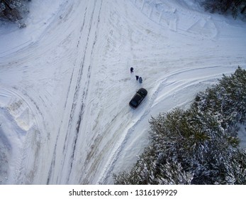 Car On A Snowy Road Top View