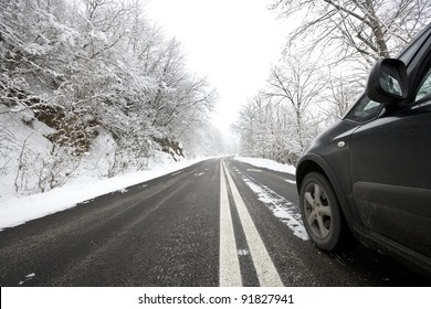 Car On Snowy Winter Road.