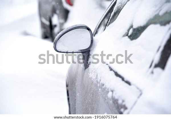 Car on the\
street in winter under the white\
snow