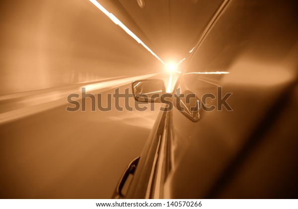 car on tunnel with light\
path