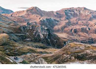 Car on the winding Grossglocker High Alpine Road in Front of the scenic mountain panorama with edelweißspitze in the background