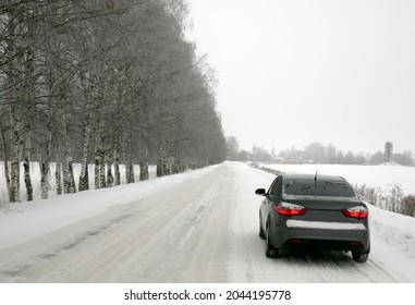 A Car On A Winter Road. The Concept Of Safe Driving.