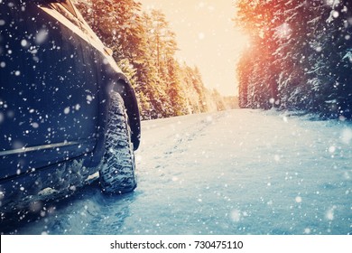 car on winter road in the morning