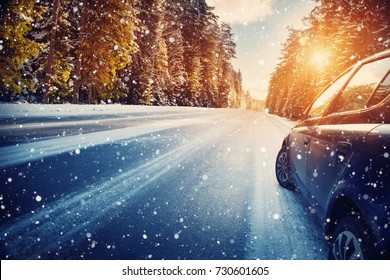 car on winter road in the morning