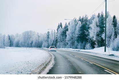 Car On Winter Road With Snow In Finland. Auto And Cold Landscape Of Lapland. Automobile On Europe Forest. Finnish City Highway Ride. Roadway And Route Snowy Street Trip. Driving