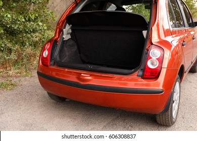 Car With Open Clean Empty Trunk Of Orange Hatchback