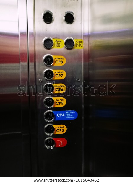 Car operating panel (cop) or lift\
/ elevator buttons for car park levels at the\
airport.