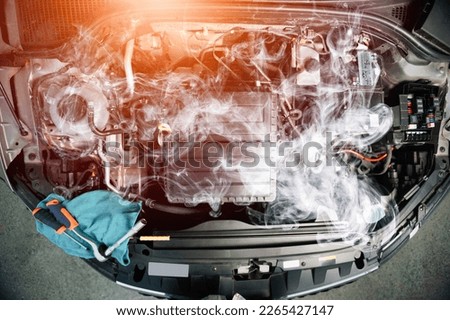 car overheating concept. Smoke from engine