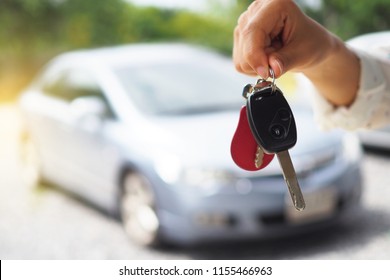 The Car Owner Is Standing The Car Keys To The Buyer. Used Car Sales        