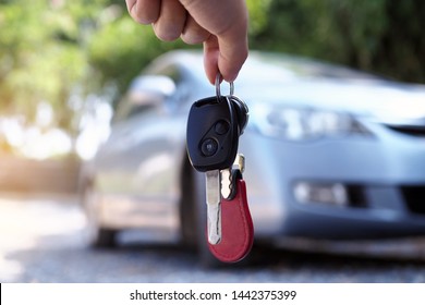 The Car Owner Is Standing The Car Keys To The Buyer. Used Car Sales      