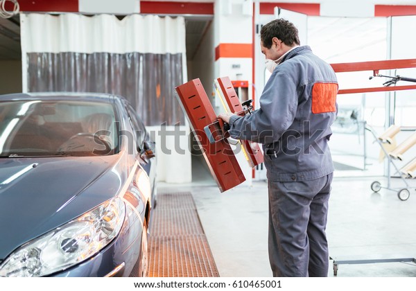 Car painting\
procedure at auto service\
store.