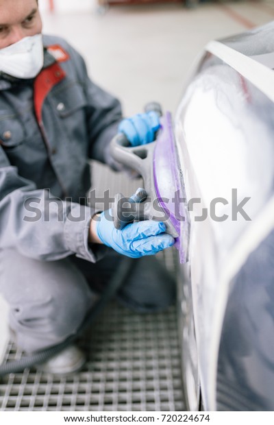 Car painting procedure at auto service store.\
Selective focus.