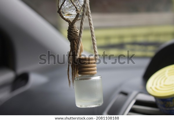 car parfume\
bottles as interior\
accessories