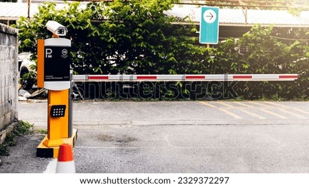 Car park automatic entry system. Security system for building access - barrier gate stop with toll booth, Security CCTV camera