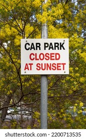 Car Park Closed At Sunset Road Sign In The Park With Yellow Wattle Background